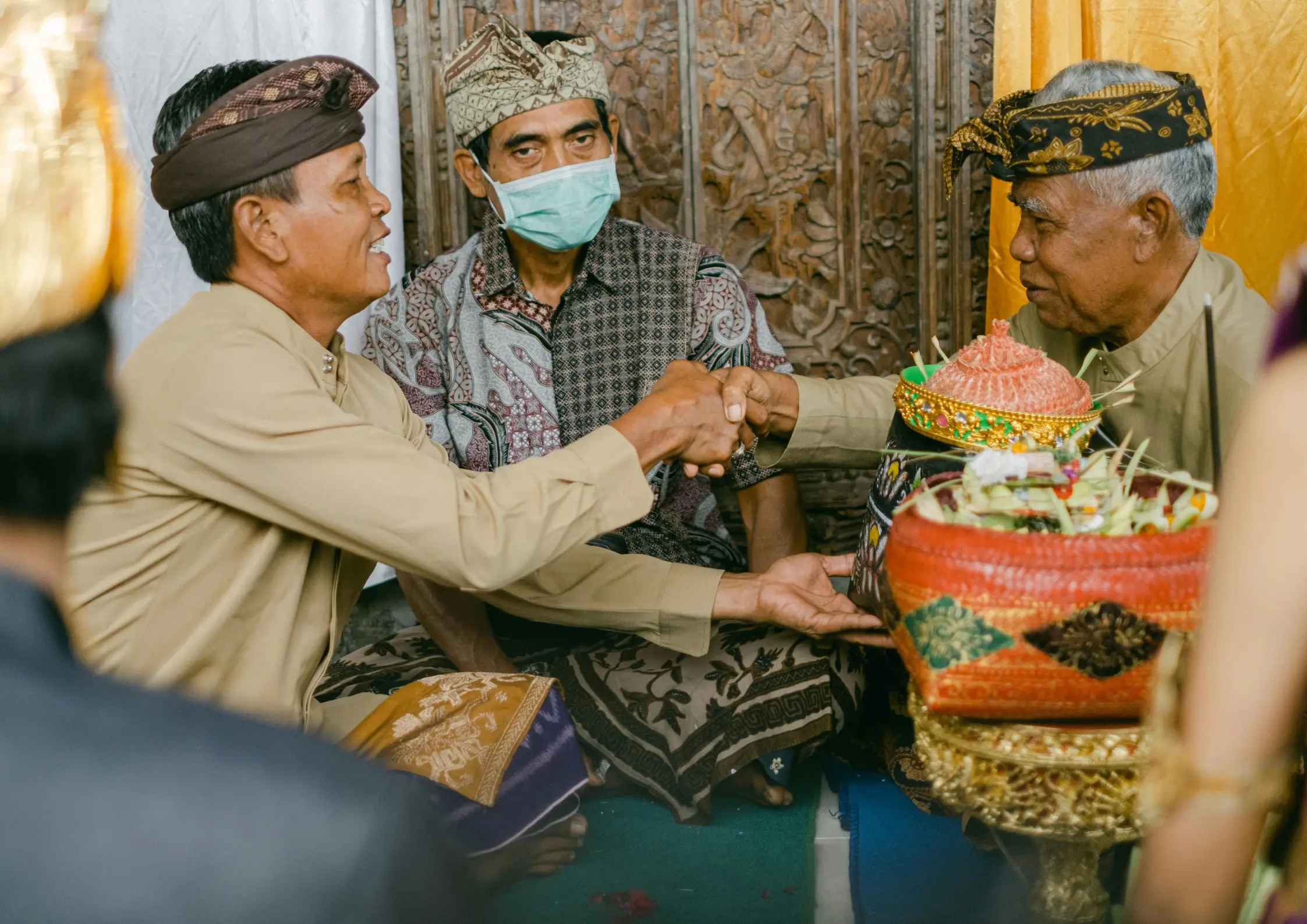 A friendly interaction of Balinese local showing respectful hand gestures in Ubud