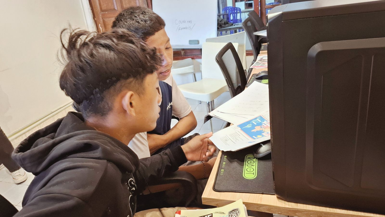 Students learning on a computer